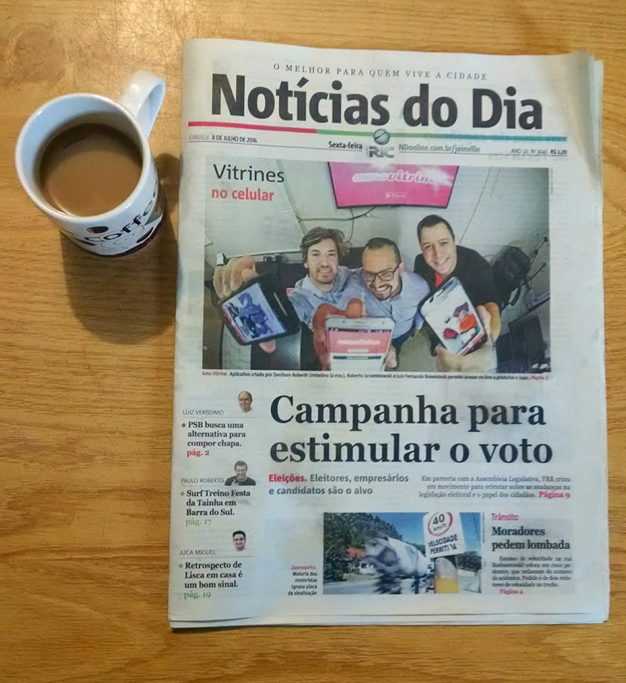 A local newspaper with the Amo Vitrine founders on the cover in Joinville
